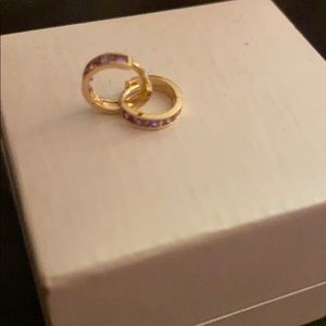 14k gold earrings with 5 purple amethyst stones.